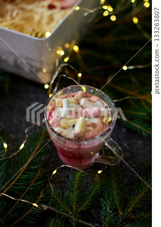 Festive Dessert With Marshmallows, Whipped Cream, and Milk Being Poured in a Cozy Holiday Setting With Twinkling Lights Festive Dessert With Marshmallows, Whipped Cream, and Milk Being Poured in a Cozy Holiday Setting With Twinkling Lights 133263807