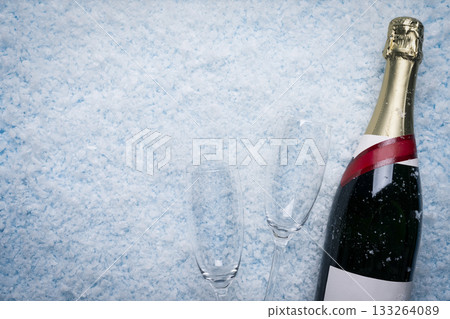 Champagne Bottle and Two Glasses on Snow Champagne Bottle and Two Glasses on Snow 133264089