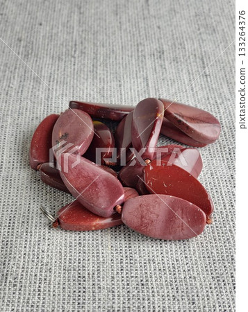 A stacked red jasper necklace. Wide, hand-cut natural stone is a traditional Ukrainian ethnic necklace 133264376