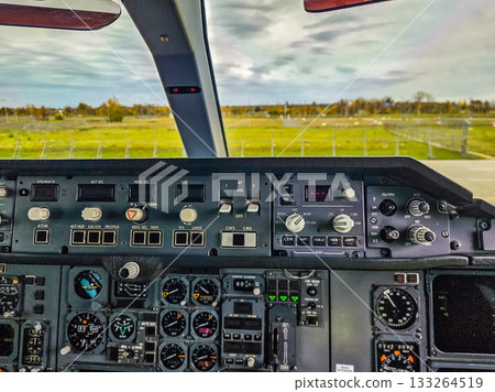 Cockpit Instrument Panel and Outside Runway View Cockpit Instrument Panel and Outside Runway View 133264519