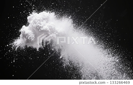 Spilled Powder Cloud. A small cloud of white powder or holi powder hangs in the air mid-shot in an otherwise 133266469