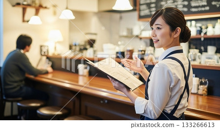 A woman working in a cafe 133266613