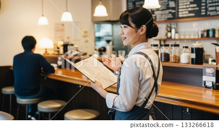 A woman working in a cafe 133266618