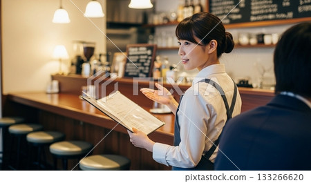 A woman working in a cafe A woman working in a cafe 133266620