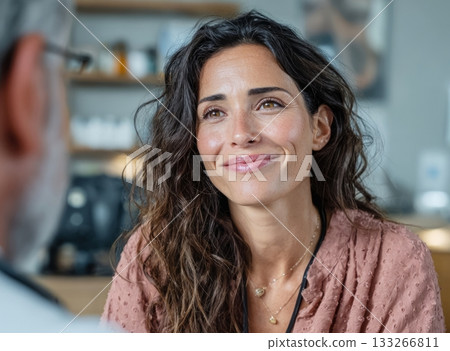 Woman patient listening to doctor during consultation Woman patient listening to doctor during consultation 133266811