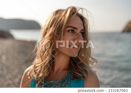 Woman beach smile. Happy young woman looking away with a joyful expression on a sunny beach. Summer vacation portrait. Woman beach smile. Happy young woman looking away with a joyful expression on a sunny beach. Summer vacation portrait. 133267065