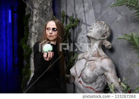 Investigator analyzing artifact surface in controlled environment 133267268