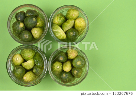 Glass jars filled with fresh cucumbers 133267676