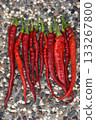 red hot peppers over stone background 133267800