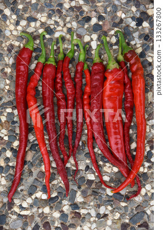 red hot peppers over stone background 133267800