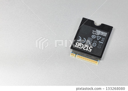 NVME PCIe solid-state drive in the M.2 2230 form factor isolated on metal background. NVME PCIe solid-state drive in the M.2 2230 form factor isolated on metal background. 133268080