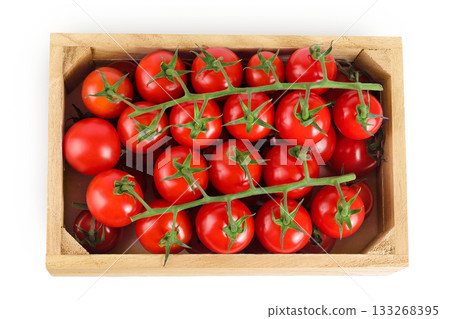 Cherry tomato bunch in a wooden box isolated on white background. Top view. Flat lay 133268395
