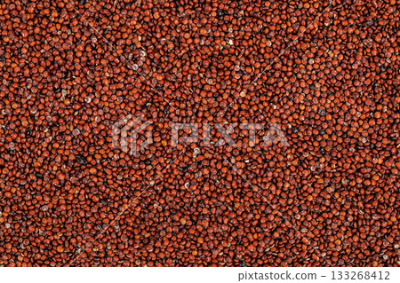 red quinoa seeds as a background. Top view. Flat lay 133268412