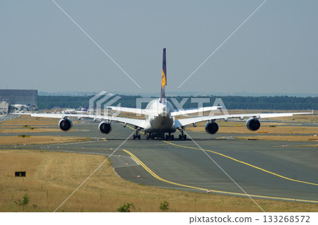 Frankfurt, Germany, July 9, 2017: Airbus A380 on Taxiway Seen from Behind Frankfurt, Germany, July 9, 2017: Airbus A380 on Taxiway Seen from Behind 133268572