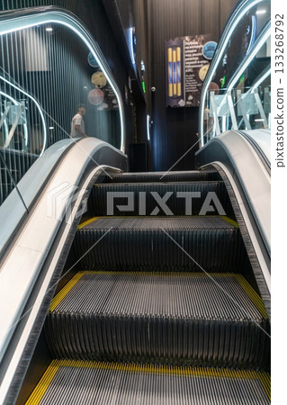 Escalator in a building, room 133268792