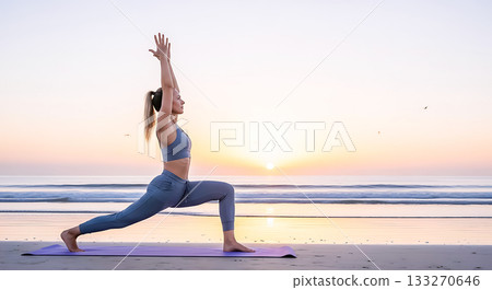 Woman in warrior pose yoga on beach at sunrise with ocean waves image 133270646