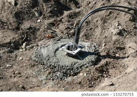 Concrete Base with Cable on Construction Site Concrete Base with Cable on Construction Site 133270755