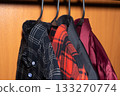 Shirts Hanging in Wardrobe on Hangers 133270774