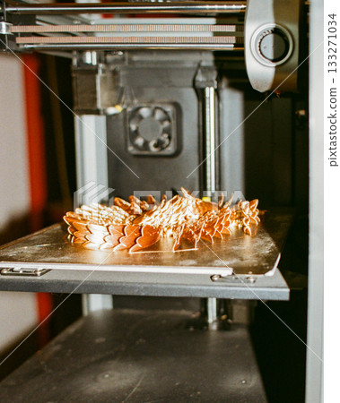 printing of three-dimensional plastic toys at factory with 3D printers. printing of three-dimensional plastic toys at factory with 3D printers. 133271034