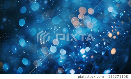 Christmas blue background with a lot of small blue and orange boke. The blue and orange colors give the image a vibrant 133271108