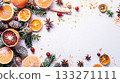 A white background with a bunch of oranges and spices. Scene is warm and inviting. Place for text. 133271111