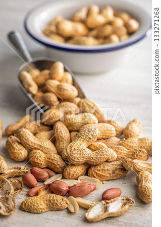 Peanuts in shell. Groundnuts on kitchen table. 133271268