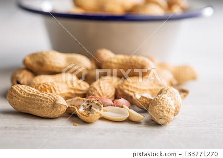 Peanuts in shell. Groundnuts on kitchen table. 133271270