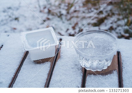 Ice in a container on the balcony 133271303