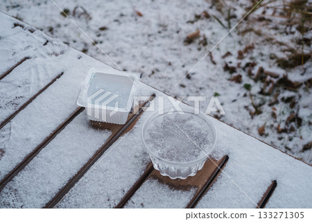 Ice in a container on the balcony 133271305