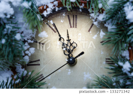 intimate view of antique watch dial featuring snowy pine branches and ornate hand craftsmanship intimate view of antique watch dial featuring snowy pine branches and ornate hand craftsmanship 133271342