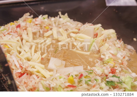 Cooking monjayaki on a hot plate Cooking monjayaki on a hot plate 133271884