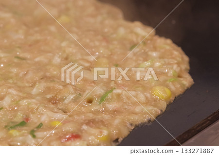 Cooking monjayaki on a hot plate 133271887