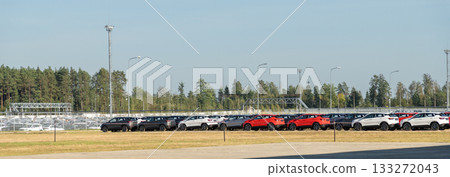 A modern automobile assembly plant filled with hundreds of brand-new SUV models 133272043