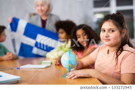 students listen to woman teacher who talks about Greece students listen to woman teacher who talks about Greece 133272945