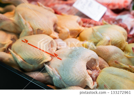 Fresh chickens on display in a supermarket Fresh chickens on display in a supermarket 133272961
