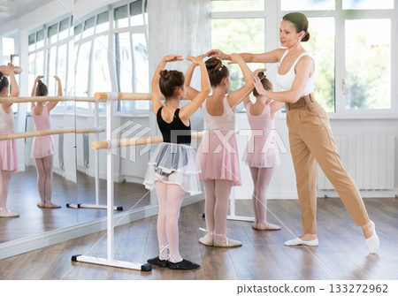 Fourth position - little girls learn ballet at choreography lesson 133272962