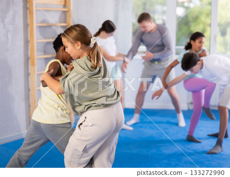 Boy and girl practicing self-defense techniques Boy and girl practicing self-defense techniques 133272990