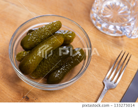 Bowl of pickled cucumbers is savory appetizer Bowl of pickled cucumbers is savory appetizer 133273014