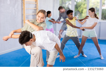 Boy and girl practicing self-defense techniques 133273060
