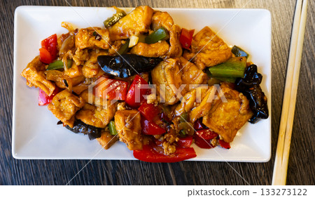 Stewed tofu with vegetables on a plate 133273122