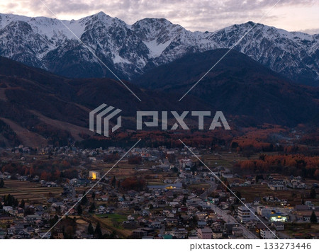 Beautiful late autumn sunset in Hakuba and the Hakuba Sanzan mountains, Hakuba Village, Nagano Prefecture (aerial shot by drone) Beautiful late autumn sunset in Hakuba and the Hakuba Sanzan mountains, Hakuba Village, Nagano Prefecture (aerial shot by drone) 133273446