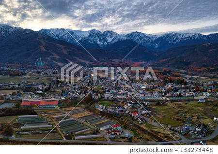 Beautiful late autumn sunset in Hakuba and the Hakuba mountain range, Hakuba Village, Nagano Prefecture (aerial shot by drone) Beautiful late autumn sunset in Hakuba and the Hakuba mountain range, Hakuba Village, Nagano Prefecture (aerial shot by drone) 133273448