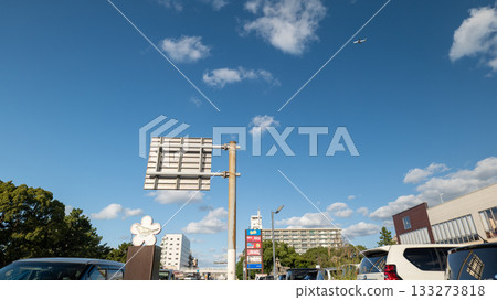 Cars passing through a highway intersection Cars passing through a highway intersection 133273818