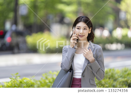 Business woman calling on smartphone 133274356