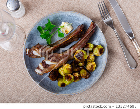 Cooked pork ribs with Brussels cabbage Cooked pork ribs with Brussels cabbage 133274695