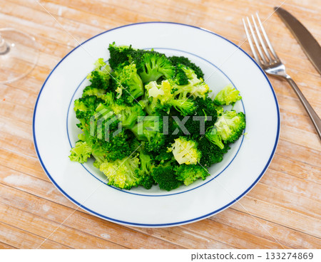 Plate of freshly roasted green broccoli for healthy vegetarian lunch 133274869