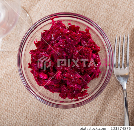 Salad made from boiled grated beetroot close up Salad made from boiled grated beetroot close up 133274876
