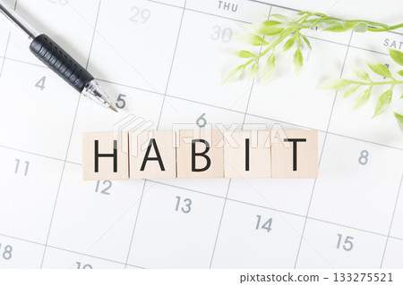 A simple composition of a calendar and HABIT blocks showing habit formation. A simple composition of a calendar and HABIT blocks showing habit formation. 133275521