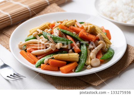 Stir fried vegetables, Green pea, Carrot, Baby corn and Shimeji mushroom with soy sauce Stir fried vegetables, Green pea, Carrot, Baby corn and Shimeji mushroom with soy sauce 133275936