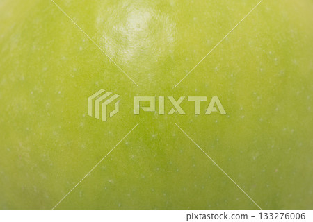 The skin of a ripe green apple as a background. The skin of a ripe green apple as a background. 133276006